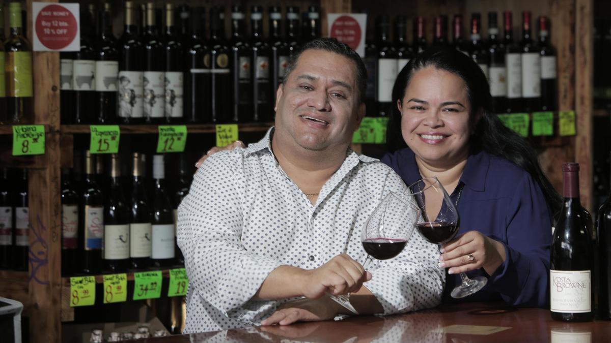 Miami, Florida, August 28, 2019- J.C. (Juan Carlos) Restrepo (left) and his life partner Joanna Fajardo (right) are the owners of Happy Wine on Calle Ocho and have been since 2010. In the last year, he was diagnosed with kidney failure and needed daily dialysis before going on the transplant list. Meanwhile, his Coconut Grove Happy Wine location struggled and he took on an investor to whom he turned over the business. But in April, he landed on the transplant list and got word a new kidney was available the very next day. Now, he has sold the Coconut Grove location and is considering changing the Happy Wine name, to which he gave up partial ownership in the settlement. But he has his health, Joanna who fought to keep both businesses running while he faced certain death without a kidney, and they have their original store that remains a favorite of locals and Miami wine lovers.