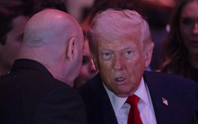 President Donald Trump talks with UFC President Dana White during UFC 327 at the Kaseya Center on Saturday, April 11, 2026, in downtown Miami, Fla.