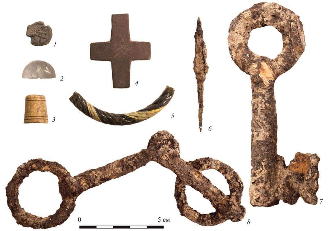 Other items, like a stone cross and a glass vessel, were also found at the archaeology site.