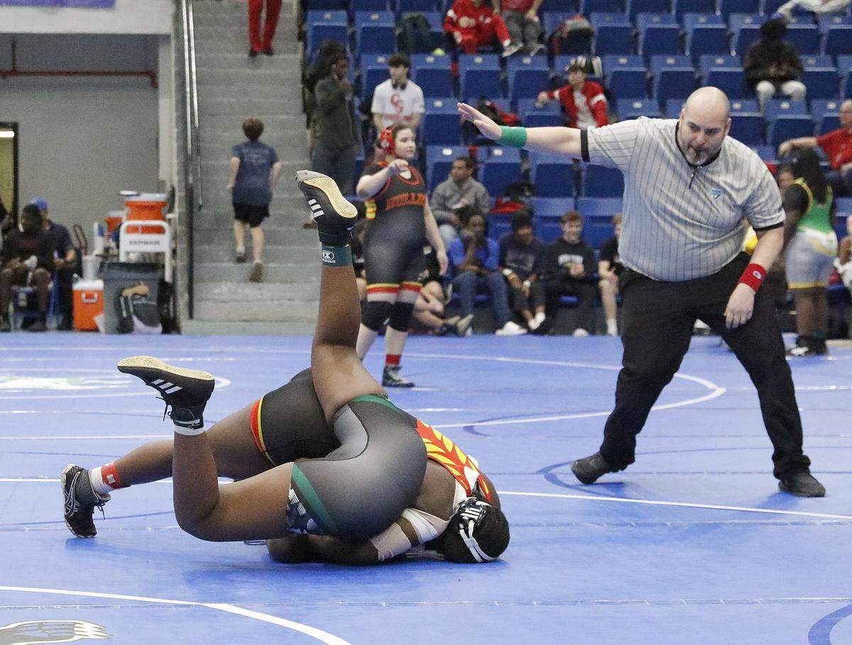 Latoya Sylvestre of South Broward HS (on top) wrestlers Ariona Eugene of Flanagan HS in the 190-pound championship match at the BCAA Wrestling Championships on Saturday, February 7, 2026 at Dillard HS in Fort Lauderdale. L. Silvestre won the match.Andrew Uloza / for Miami Herald