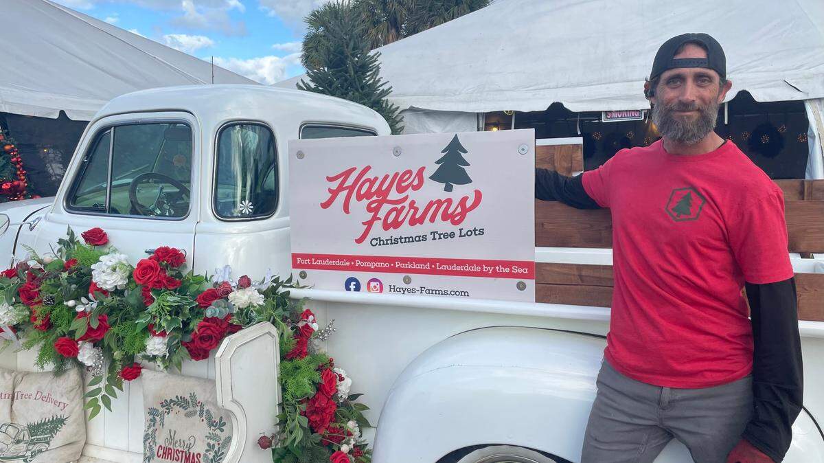 Triston Cole, manager of the Hayes Farms Christmas tree lot in Fort Lauderdale, which sells premium grade Fraser firs from North Carolina. There’s a good stock of the coveted tree there this year but it may be in shorter supply in coming years because of flooding from Hurricane Helene in the state.