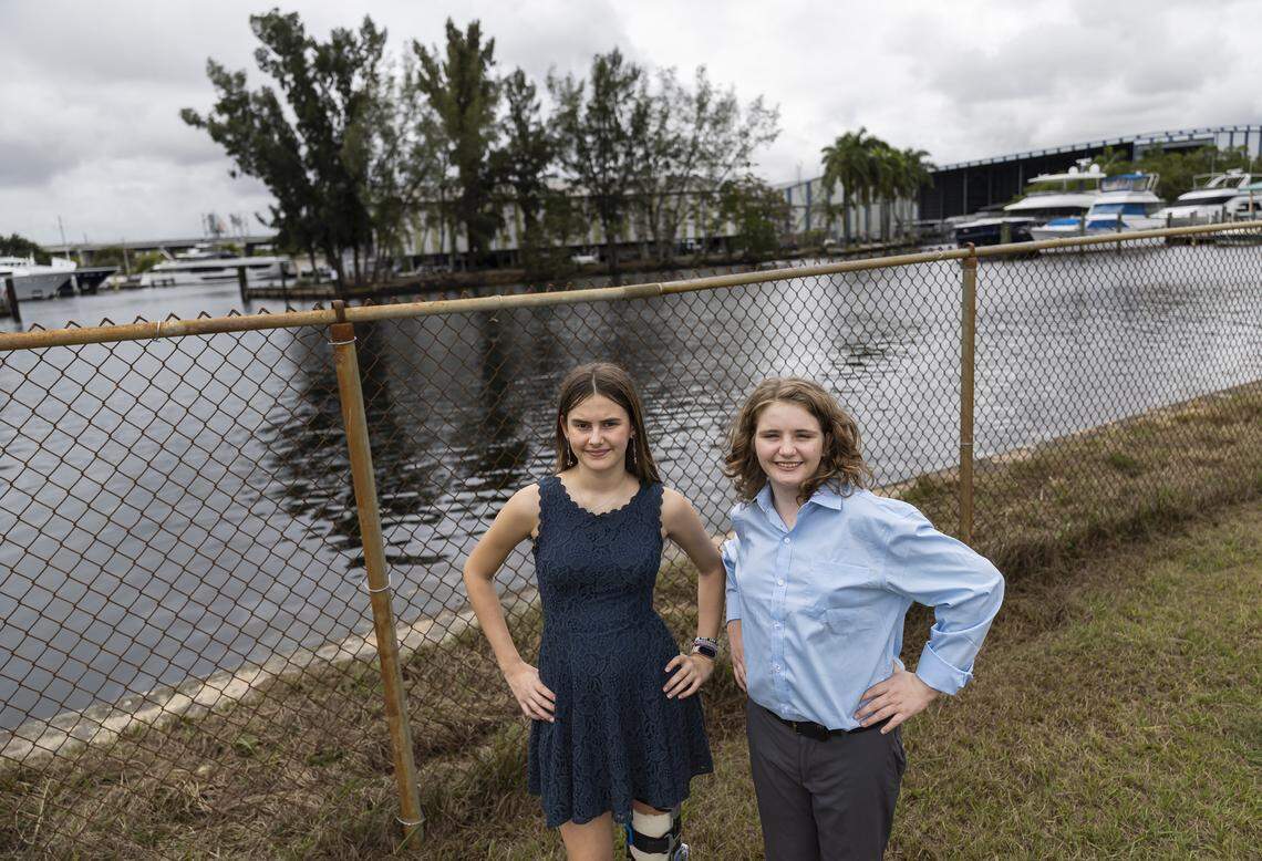 Students Eleonora Mariani, 13, left, and Nate Buck, 12, are photographed on the space where a potential new living shoreline may be built at New River Middle School on Thursday, Jan. 22, 2026, in Fort Lauderdale, Fla.