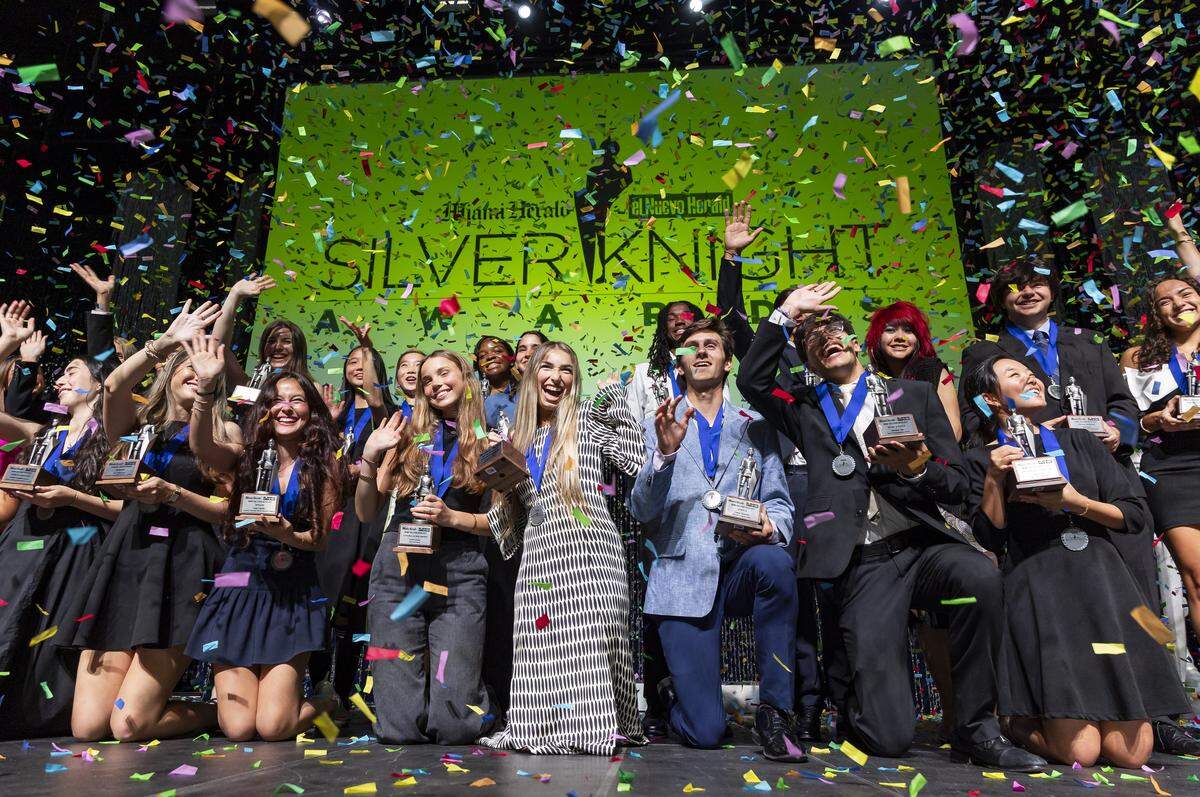 Silver Knight Award winners celebrate on stage Tuesday, May 12, after receiving their awards during the Miami Herald/el Nuevo Herald 68th Silver Knight Awards ceremony at the James L. Knight Center in Miami.