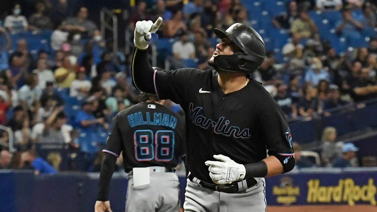 Miami Marlins’ Miguel Rojas gestures as he jogs home after hitting a solo home run off Tampa Bay Rays starter Shane McClanahan during the third inning of a baseball game Saturday, Sept. 25, 2021, in St. Petersburg, Fla. (AP Photo/Steve Nesius)