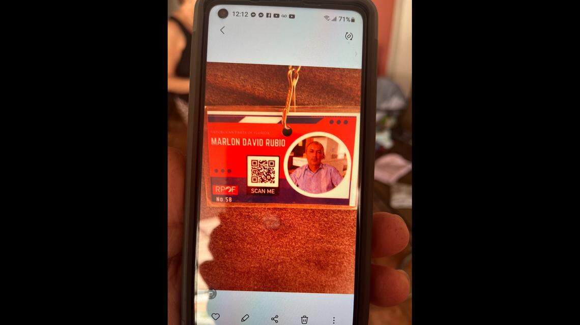 Noel Almora, of Hialeah Gardens, shows reporters a photo of the canvasser who stopped by his house last year.