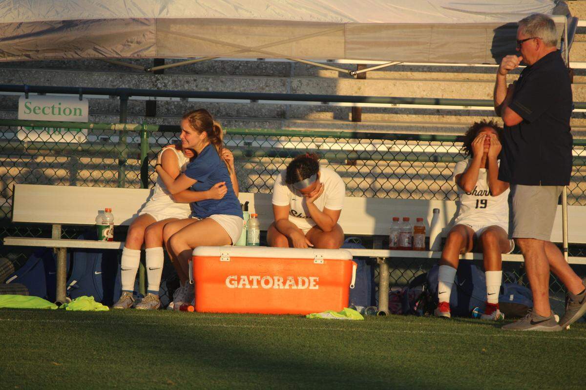 University School girls’ soccer players console each other on the bench following a 6-0 loss to Montverde Academy in the Class 3A state championship game in DeLand on Wednesday afternoon.