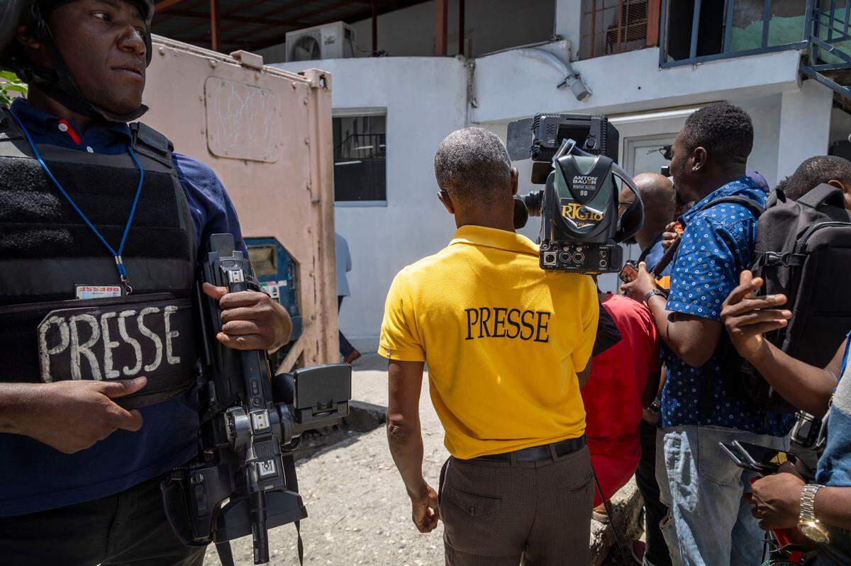 Haitian journalists in Port-au-Prince set up for a press conference at a local hospital.