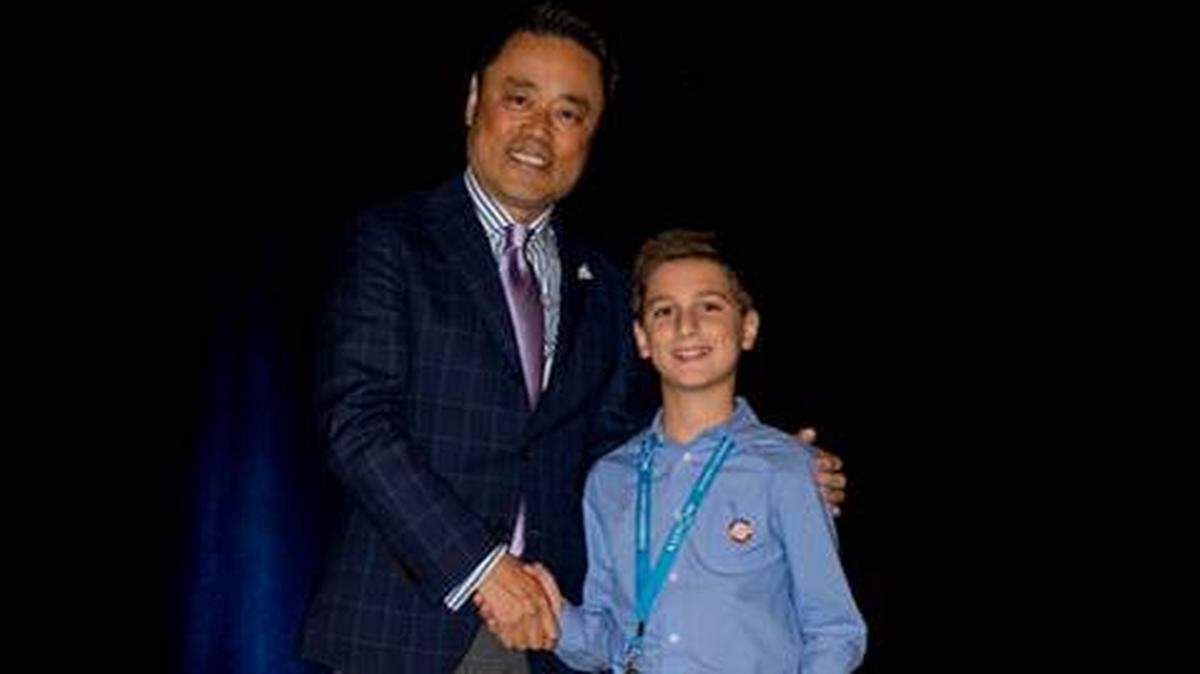 Sebastian Estrada, right, of Somerset Academy participated in the second annual Kumon Student Conference in Canada. He is pictured with Mino Tanabe, president of Kumon North America.