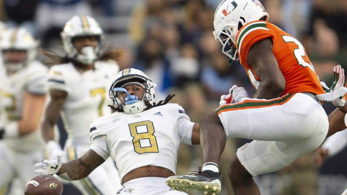 Miami safety Kamren Kinchens, right, breaks up pass intended for Georgia Tech wide receiver Nate McCollum (8) in the first half of an NCAA college football game Saturday, Nov. 12, 2022, in Atlanta. (AP Photo/Hakim Wright Sr.)