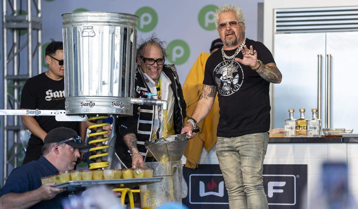 American celebrity chef Guy Fieri prepares a drink for guests attending the Goya Foods' Grand Tasting Village during the Food Network South Beach Wine & Food Festival on Saturday, Feb. 21, 2026, in Miami Beach, Fla.