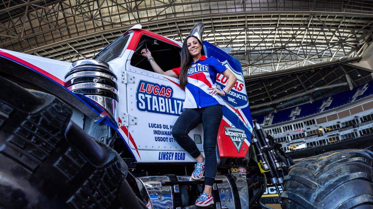 Lucas Stabilizer driver Linsey Read stands on her truck during Monster Jam media day at LoanDepot Park in Miami, Florida on Thursday, February 22, 2024.