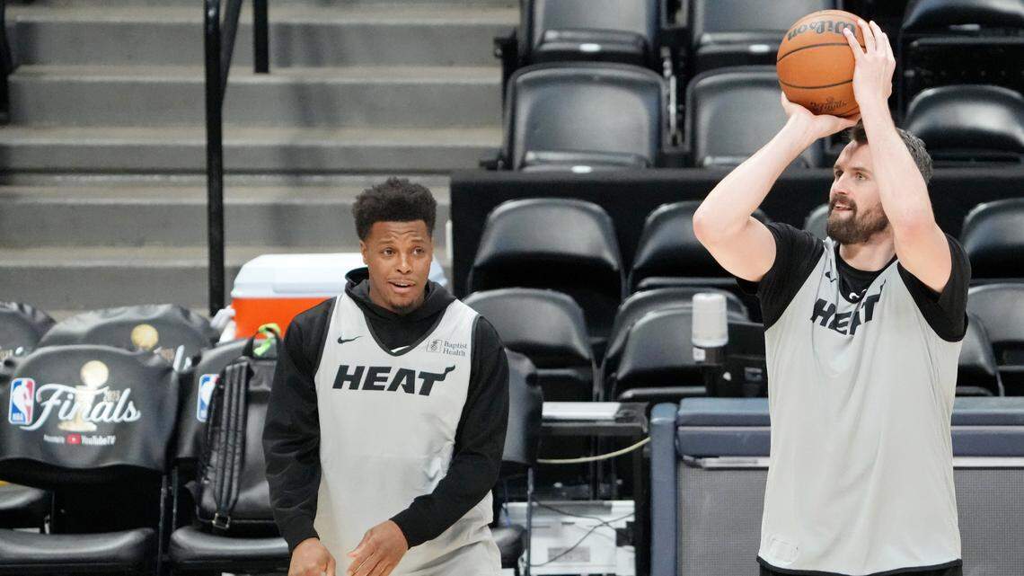 Miami Heat forward Kevin Love (42) shoots the ball as guard Kyle Lowry (7) reacts during a practice session on media day before the 2023 NBA Finals at Ball Arena.