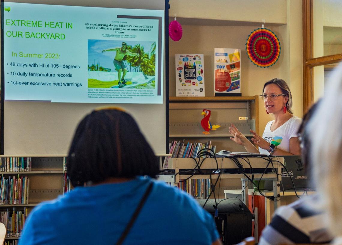 Olivia Collins, a vice president at the Cleo Institute, teaches people strategies to survive extreme heat, hurricanes and other weather challenges during an ‘Extreme Weather Training’ session at the Culmer Overtown Branch Library in Miami on Saturday, Sept. 28, 2024.