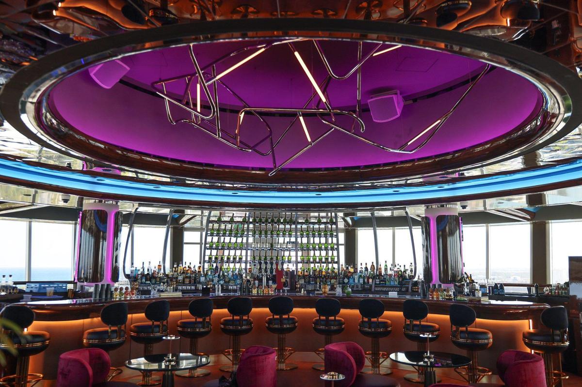 The interior bar area at Pier Top, the revolving lounge atop the tower at the newly renovated Pier Sixty-Six resort in Fort Lauderdale. The bar was crafted from reclaimed wood and has shimmering glass shelves.