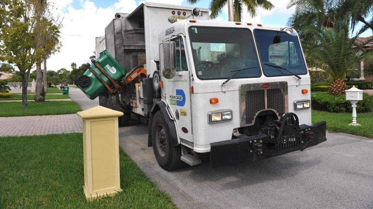 FILE - A man found dead in a garbage bin Wednesday had been accused of shooting his ex-wife the night before, according to police.