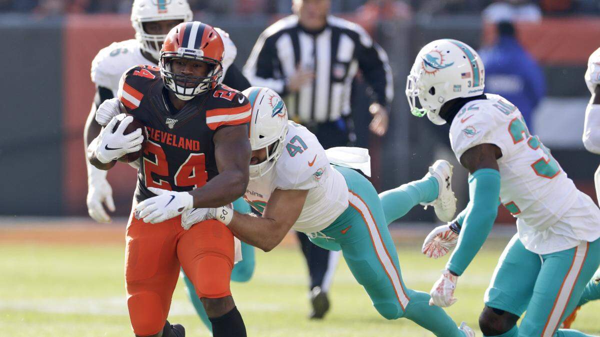 Cleveland Browns running back Nick Chubb (24) rushes against the Miami Dolphins during the first half of an NFL football game, Sunday, Nov. 24, 2019, in Cleveland.