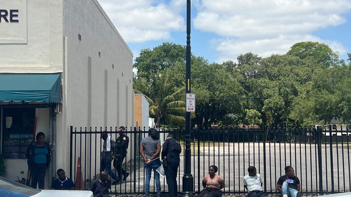 Miami police detain several people outside a Little Haiti barber shop Wednesday, April 30, 2025.