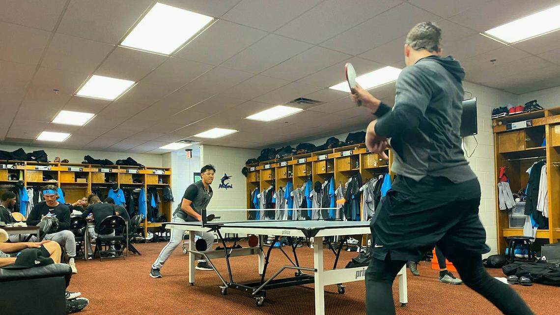 Miami Marlins pitcher Jordan Yamamoto (left) and third baseman Brian Anderson (right) play a game of ping-pong inside their clubhouse at Roger Dean Chevrolet Stadium on Sunday, March 8, 2020, in Jupiter, Florida.