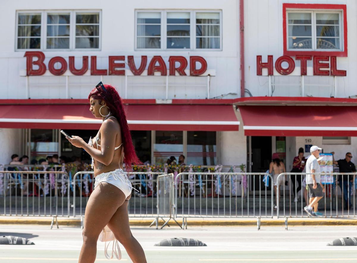 A girl makes her way down Ocean Drive near the Boulevard Hotel during spring break on Friday, March 15, 2024, in Miami Beach.&nbsp;