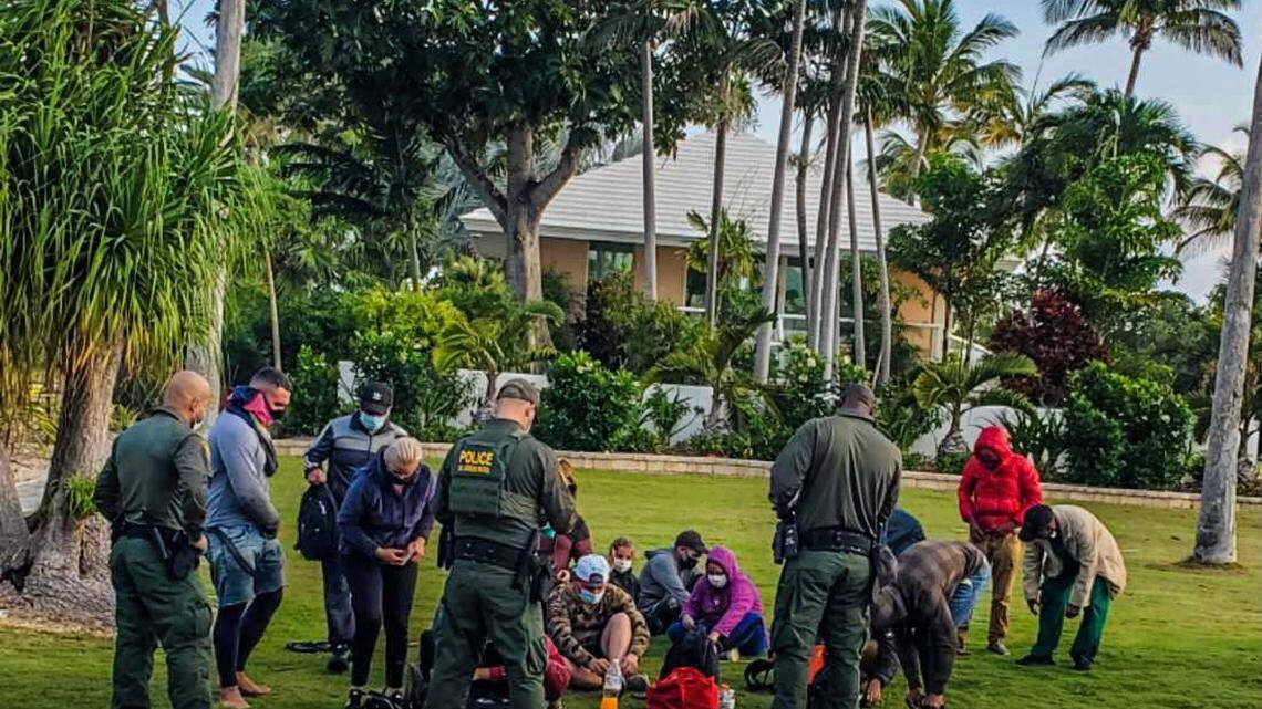 U.S. Border Patrol agents stand in front of Cuban migrants on Summerland Key in the Florida Keys Thursday, March 17, 2022.
