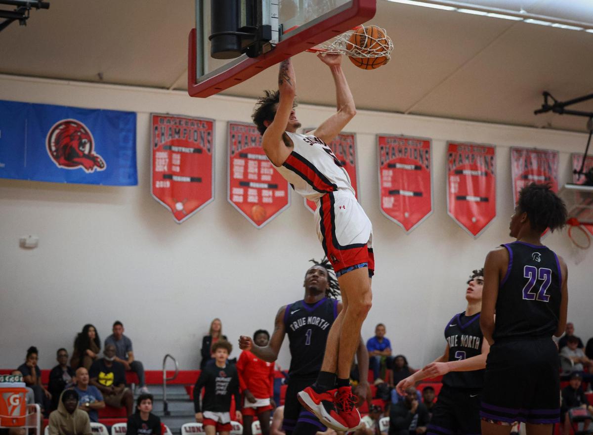 Sagemont’s Tynan Becker (5) dunks the ball during the fourth quarter of the regional semifinal playoff game between the Sagemont Prep Lions and the True North Titans on Tuesday, Feb. 21, 2023, at Sagemont High School.