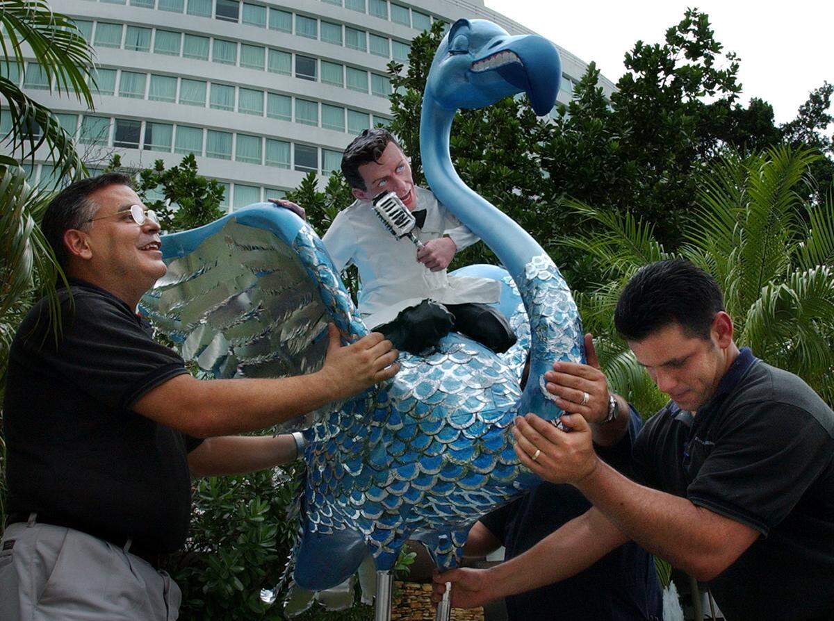 Fontainebleau Hilton Engineering Department supervisors gingerly Fontainebleau hotel engineers in 2002 handle handle the newest “Art In Public Places” arrival in Miami Beach: an eight-foot Blue Flamingo ridden by singer Frank Sinatra.