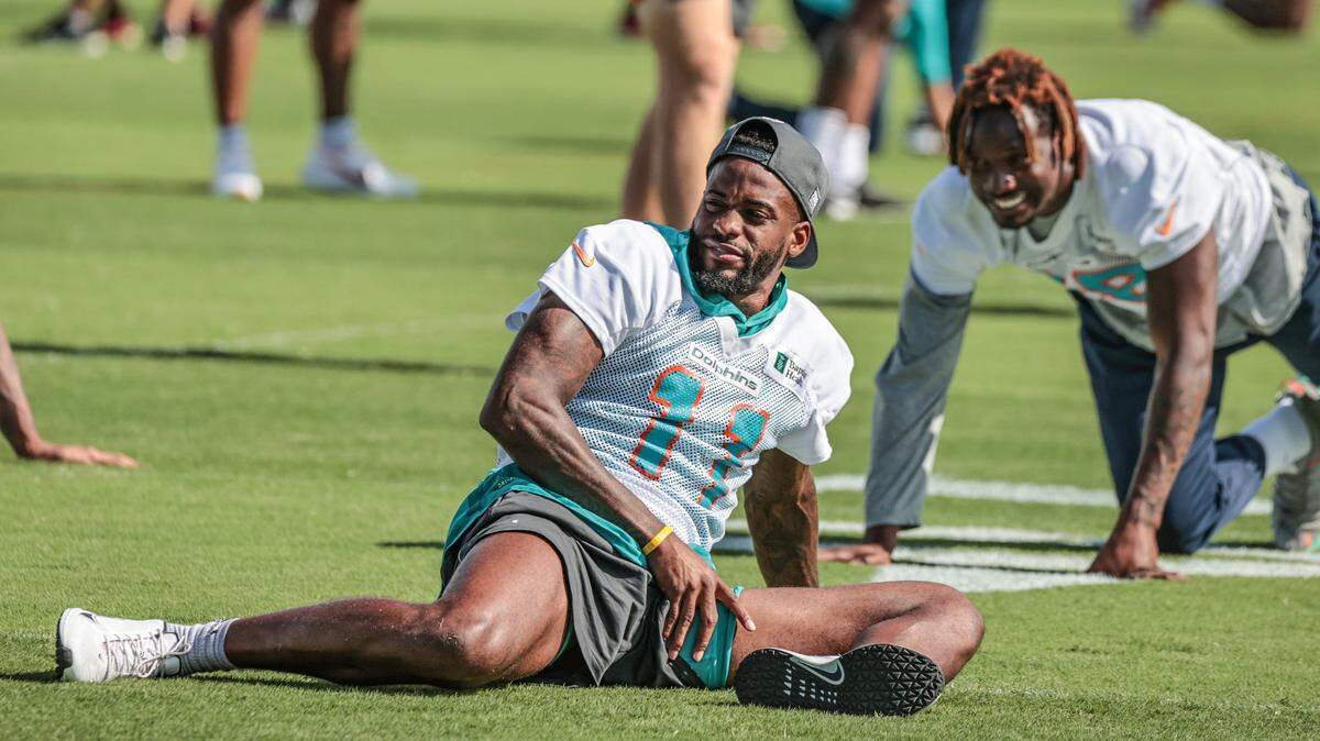 Miami Dolphins wide receiver DeVante Parker (11) and wide receiver Preston Williams (18) stretch during warmups at Baptist Health Training Complex in Miami Gardens on Sunday, December 08, 2021. ( Al Diaz Photo / Miami Herald )