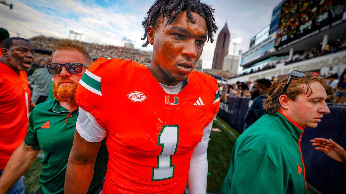 Miami Hurricanes quarterback Cam Ward (1) walks off the field after the loss against the Georgia Tech Yellow Jackets during an NCAA game at Bobby Dodd Stadium at Hyundai Field in Atlanta, Georgia on Saturday, November 9, 2024.