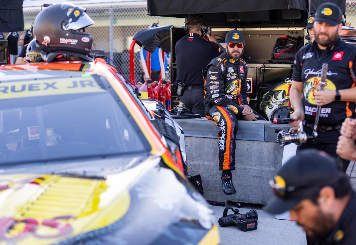 Martin Truez Jr. #19 with Joe Gibbs Racing watches as mechanics work on his car before participating in a 4EVER 400 NASCAR Cup Series practice at the Homestead-Miami Speedway on Saturday, Oct. 21, 2023, in Homestead, Fla.