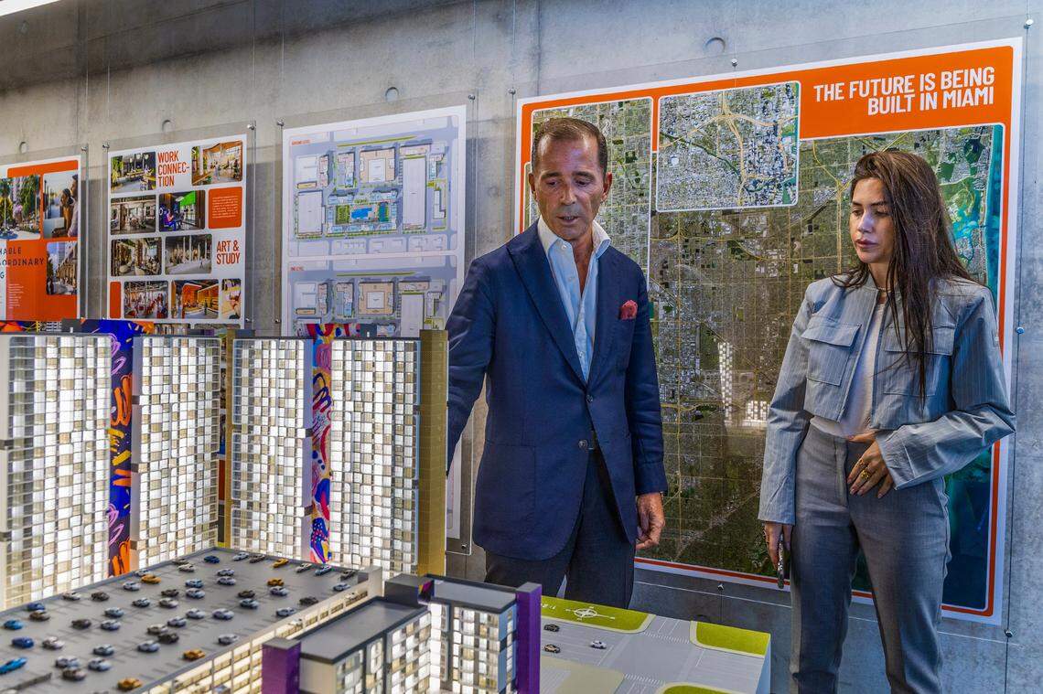 Developer Pablo Castro and his daughter, Paula Castro, head of strategy and business development for his company, show off a scale model of their $880 million HueHub development, which will bring 4,000 apartments to Miami-Dade County’s West Little River area. The developer is setting aside 3,000 apartments at unusually low rents for first responders and teachers.