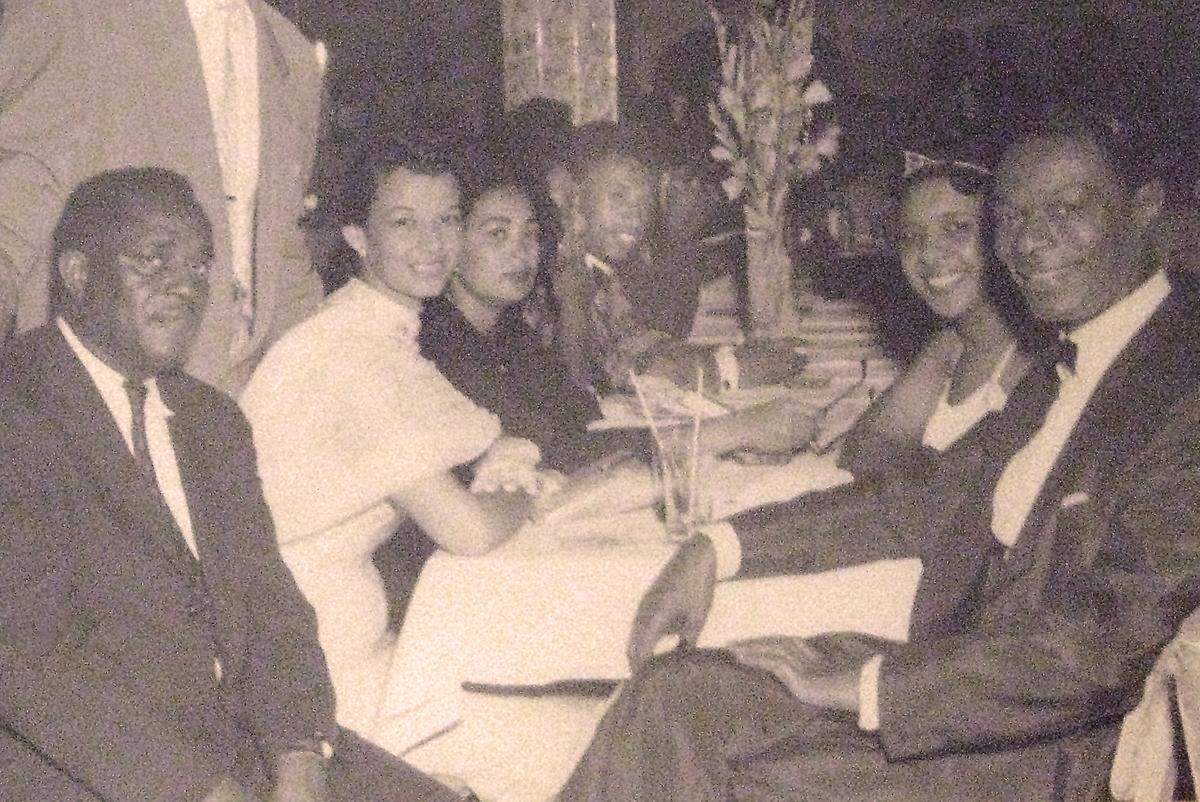 Nat King Cole, right front, with Judge Johnson, left front, at the Knight Beat, the nightclub at The Sir John Hotel in Overtown’s heyday. Photo courtesy of John Johnson