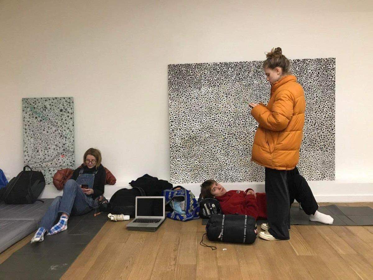 Artists and colleagues take shelter at Voloshyn Gallery in Kyiv, Ukraine. The gallery is located in a historic building that was used as a bomb shelter in World War II.