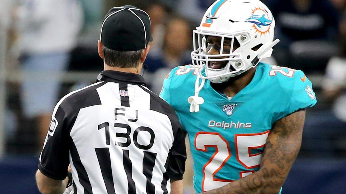 Miami Dolphins Xavien Howard (25) is departed from an alteration late in the fourth quarter as they play the Dallas Cowboys at AT&T Stadium in Arlington, Texas, Sunday, September, 22, 2019.