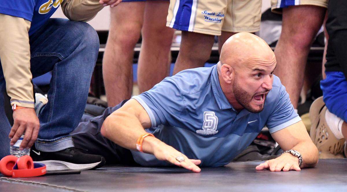 South Dade head coach Victor Balmeceda stirs his team on to victory during the Class 3A state championship duel at the FHSAA Duals on Saturday at Osceola High School in Kissimmee.
