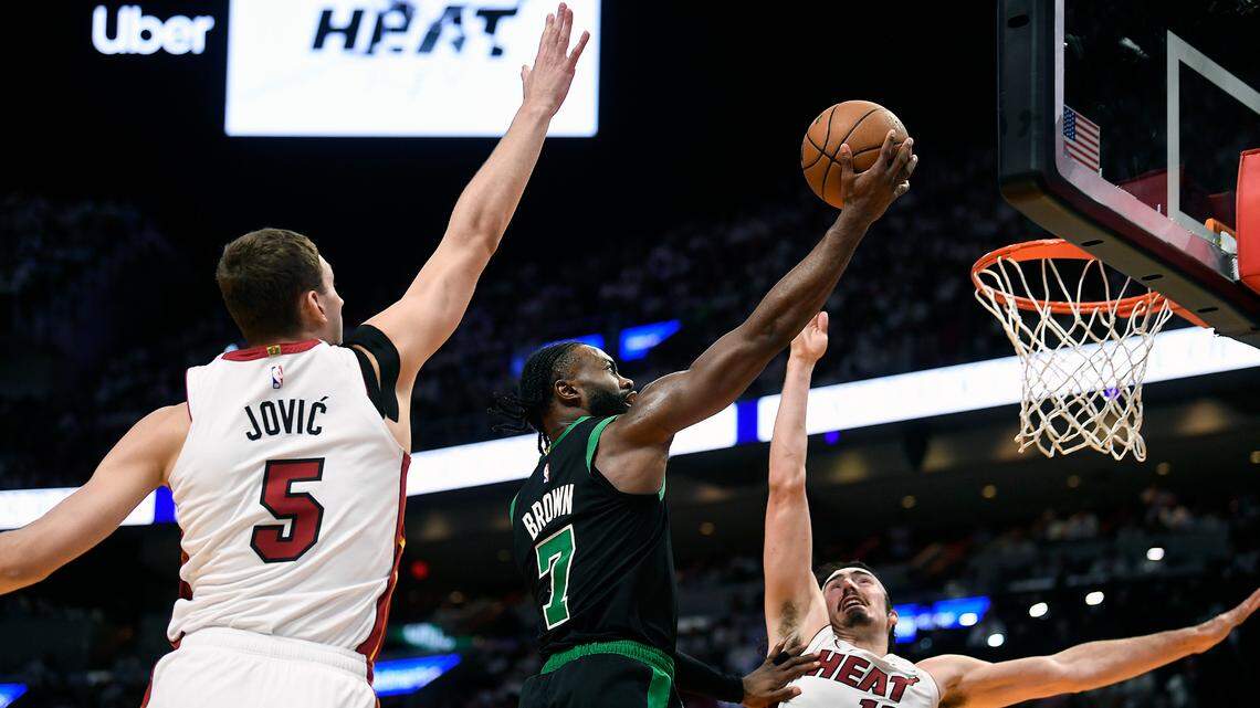 Boston Celtics guard Jaylen Brown (7) scores on Miami Heat forward Nikola Jovic (5) and guard Jaime Jaquez Jr. (11) during the second quarter of game four of the first round for the 2024 NBA playoffs at Kaseya Center.
