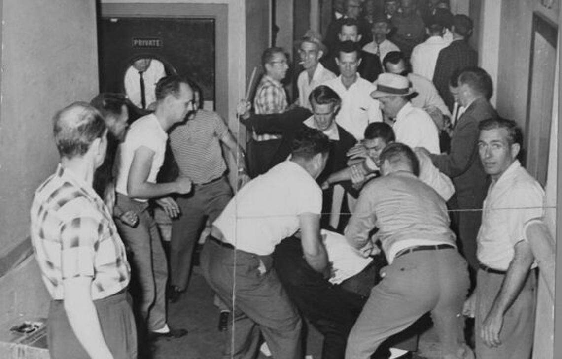 White men gang up on and beat a Freedom Rider from the North.