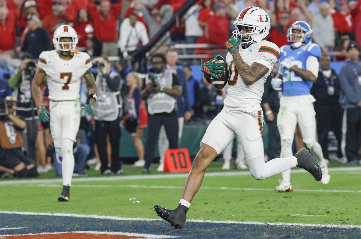Miami Hurricanes wide receiver Keelan Marion (0) scores in the first half of a College Football Playoff semifinal against the Mississippi Rebels in the Fiesta Bowl at State Farm Stadium on Thursday, January 8, 2026 in Glendale, Arizona.