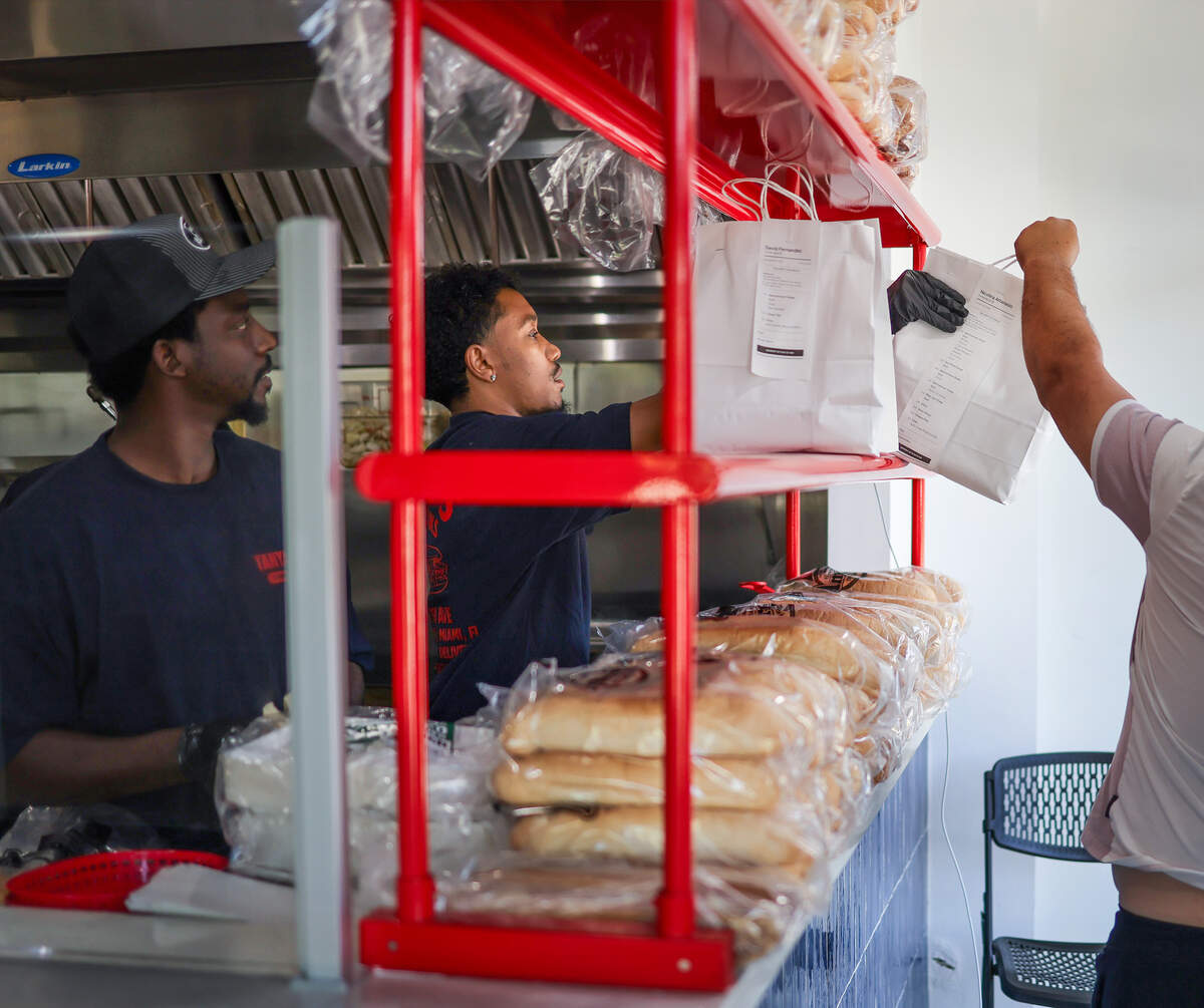 Miami native Siddiq Kancey hands over to-go orders for pickup at Tanya Jo’s Cheesesteaks on Thursday, Oct. 15, 2026.