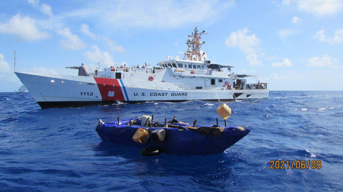 A rustic boat used by Cuban migrants to try to reach South Florida floats in front of the Coast Guard Cutter Isaac Mayo, 27 miles south of Long Key on Wednesday, June 9, 2021. A law enforcement team from the cutter interdicted 16 Cuban migrants from the craft.
