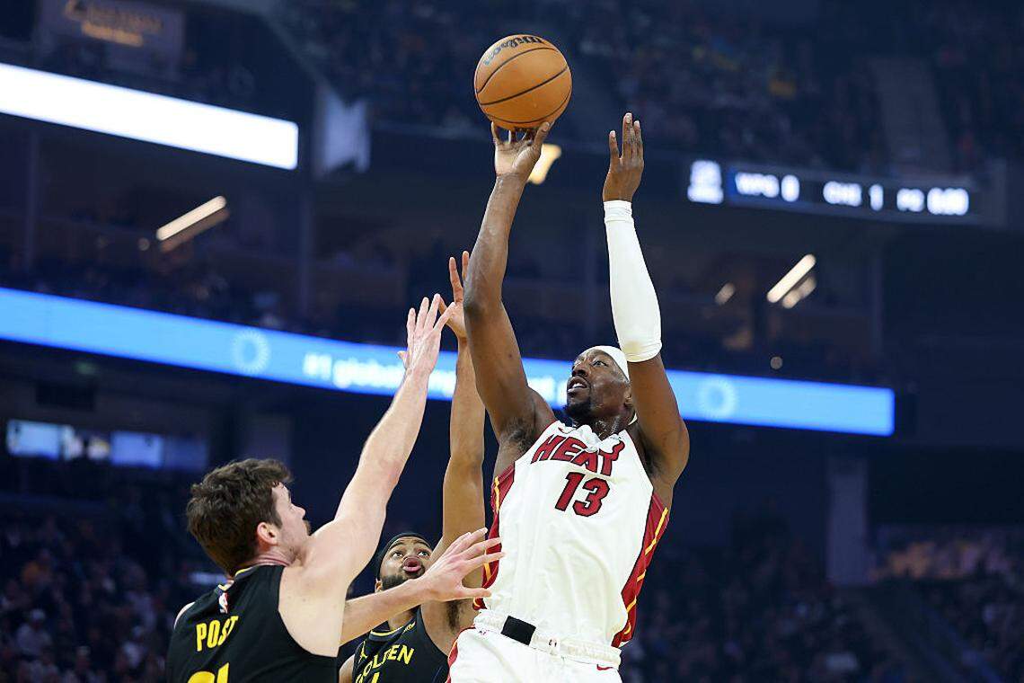 Bam Adebayo #13 of the Miami Heat shoots over Quinten Post #21 of the Golden State Warriors during the first quarter at Chase Center on January 19, 2026 in San Francisco.