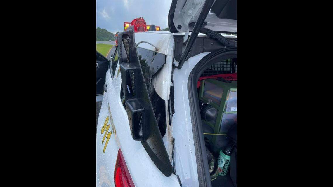 The lightning strike hit the SUV’s roof and back window, breaking glass and popping off fittings, a photo shows.