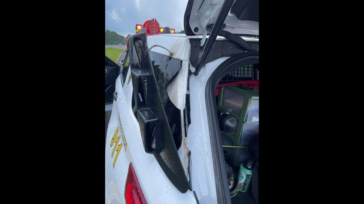 The lightning strike hit the SUV’s roof and back window, breaking glass and popping off fittings, a photo shows.