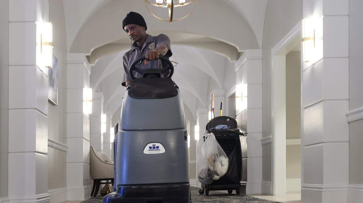 Ronald Estime, 47, a custodial worker and former Temporary Protected Status recipient, operates a commercial rug cleaning machine at Sinai Residences in Boca Raton, Thursday, Jan. 29, 2026. Many Haitian current employees with TPS now fear deportation.

Sinai Residences, a premium elderly care facility in Boca Raton, has legally employed Haitian workers, including some with Temporary Protected Status. Those workers now fear being returned to Haiti, which remains in turmoil.


