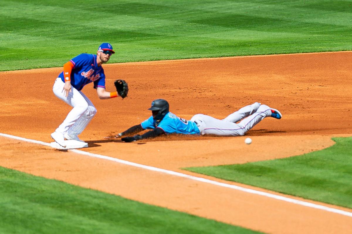 Miami Marlins center fielder Monte Harrison (63) steals third base in the first inning against the New York Mets during a spring training MLB game at Clover Park in Port St. Lucie, Florida on Saturday, February 22, 2020.