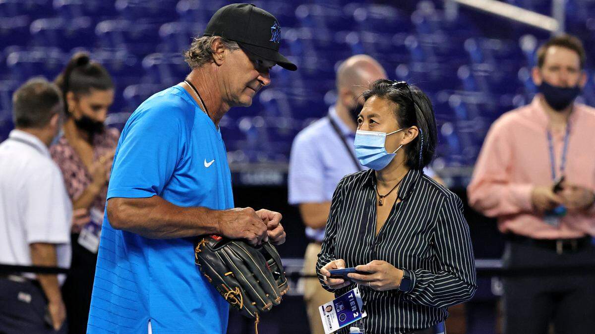 Miami Marlins manager Don Mattingly (8) talks with Marlins General Manager Kim Ng during batting practice before the start of their baseball game against the Colorado Rockies at loanDepot park on Wednesday, June 9, 2021 in Miami, Florida.