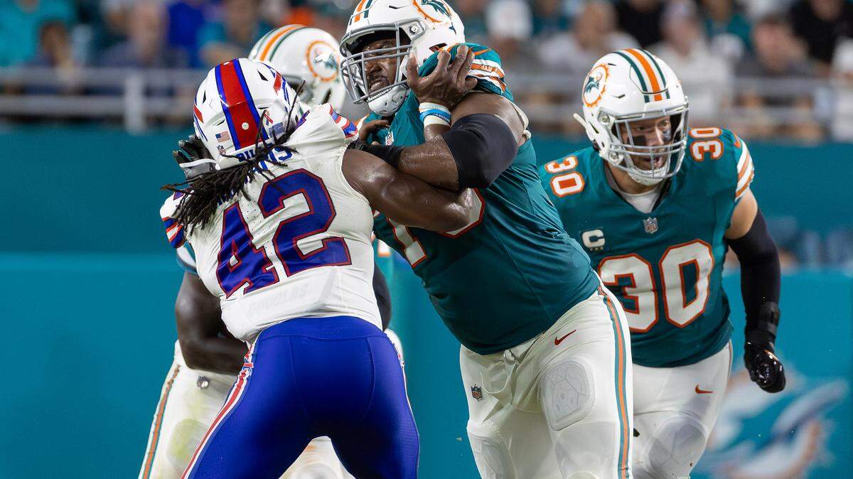 Miami Dolphins guard Austin Jackson (73) blocks Buffalo Bills linebacker Dorian Williams (42) in the first half of their NFL game at Hard Rock Stadium on Thursday, Sept. 12, 2024, in Miami Gardens, Fla.