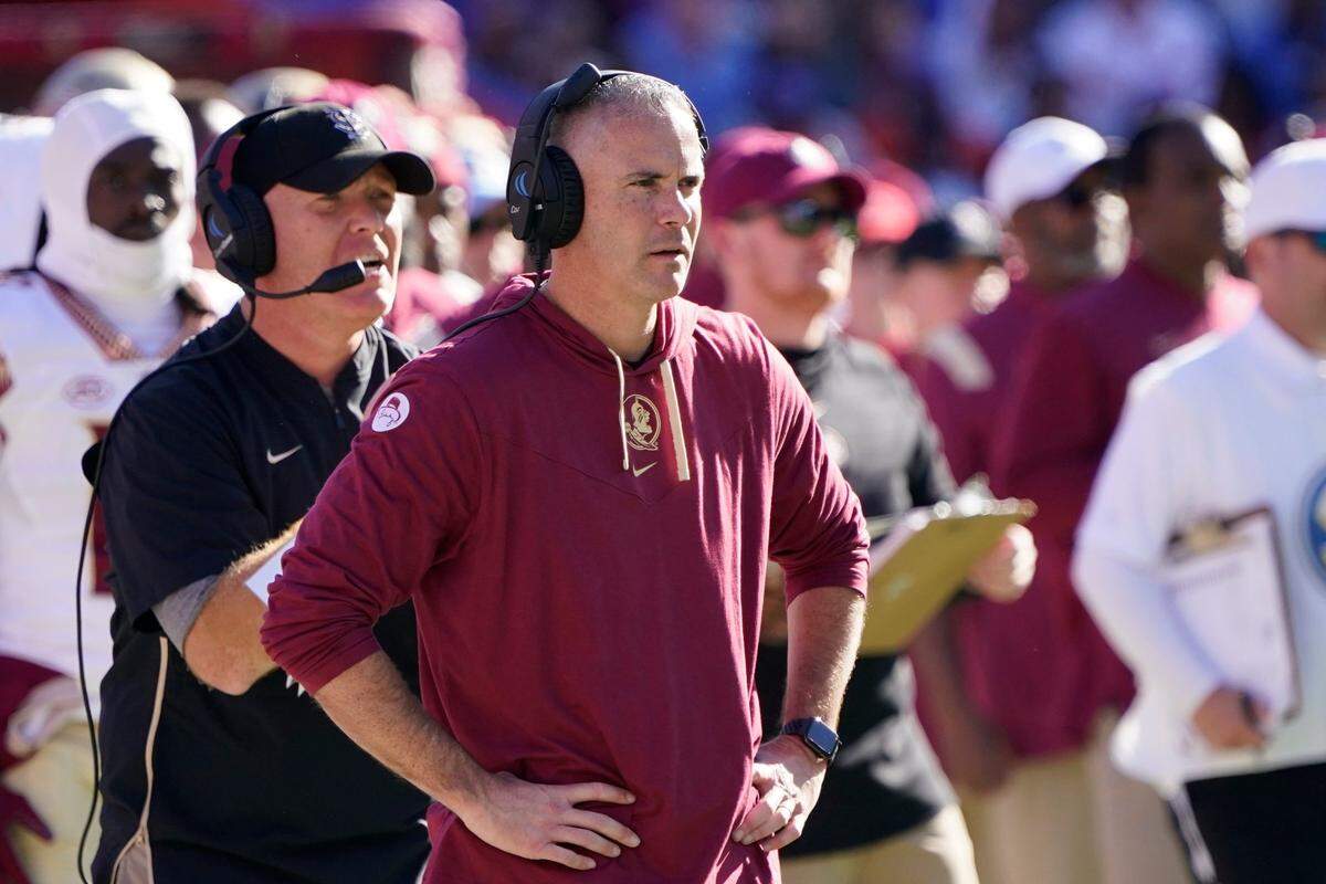 Florida State head coach Mike Norvell watches play during the second half of an NCAA college football game against Florida, Saturday, Nov. 27, 2021, in Gainesville, Fla. (AP Photo/John Raoux)