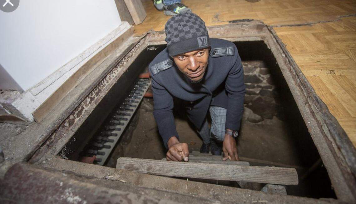 Former NBA star Ray Allen crawling out of space where a Polish family hid Jews from the Nazis during the Holocaust.