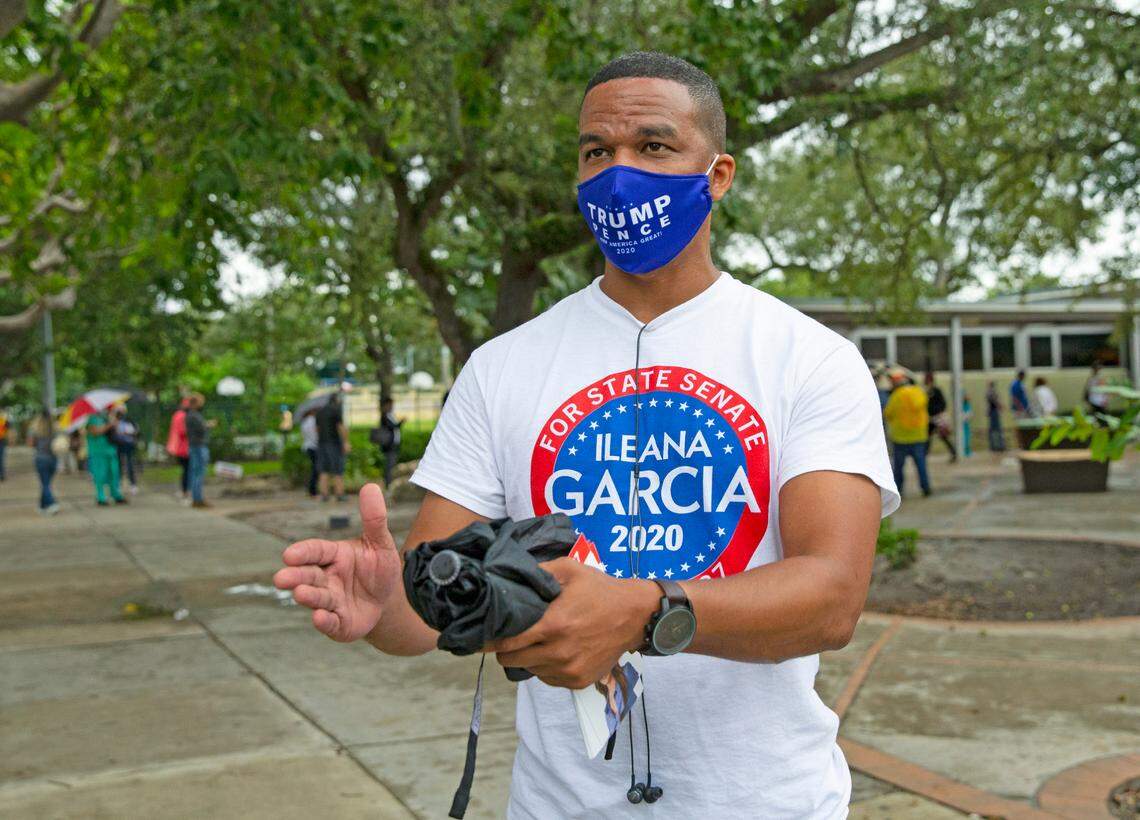 Miami-Dade resident and President Donald J. Trump supporter Ramiro Collazo talks to el Nuevo Herald reporter Mario Penton on first day of early voting for the general election at Shenandoah Branch Library located at 2111 SW 19th St. on Monday, October 19, 2020, in Miami, Florida.