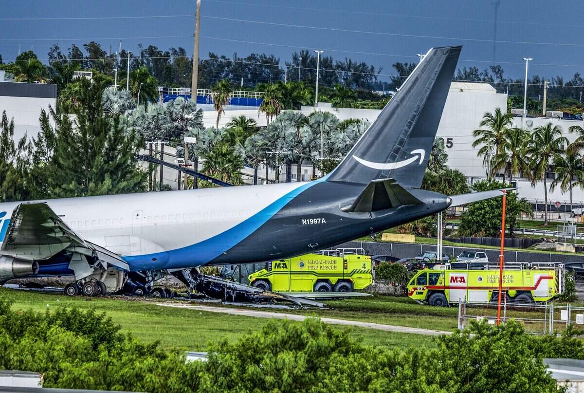 View of the tail and the landing gear of an Amazon cargo that plane crashed at Miami International Airport Sunday afternoon, causing a full ground stop that halts all flights on Sept. 6, 2026.